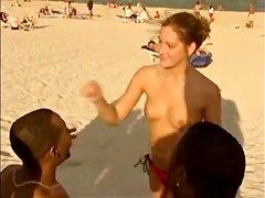 Kinky girls tease hard in a hot voyeur beach group fun