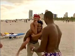 Kinky girls tease hard in a hot voyeur beach group fun