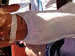 Watch thru white suit showing pink belt