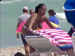 Plump breasted girl caught in a voyeur beach nudism video