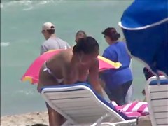 Plump breasted girl caught in a voyeur beach nudism video