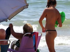 Topless legal age teenager with not her grandfathers at beach