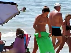 Topless legal age teenager with not her grandfathers at beach