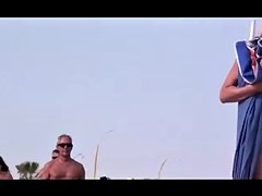 French nudist beach Cap d'Agde people walking in nature's garb 02