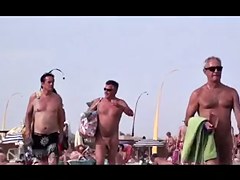 French nudist beach Cap d'Agde people walking in nature's garb 02