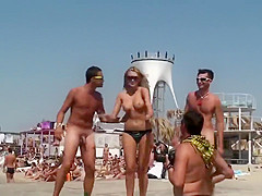 Topless babe dancing with naked guys in public
