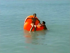 Naked brunette teens splash in the lake