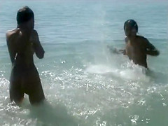 Naked brunette teens splash in the lake
