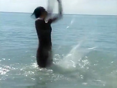 Naked brunette teens splash in the lake