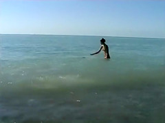 Naked brunette teens splash in the lake