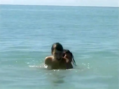 Naked brunette teens splash in the lake