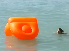 Naked brunette teens splash in the lake