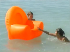 Naked brunette teens splash in the lake