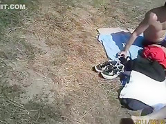 Nudist camp at the lake with lots of men and women