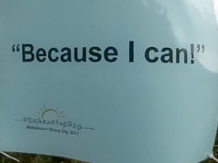 Hundreds of nudist people running into the sea naked