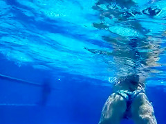 Attractive girl gets groped by her friend under the water