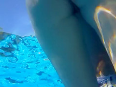 Attractive girl gets groped by her friend under the water