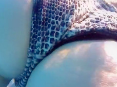 Attractive girl gets groped by her friend under the water