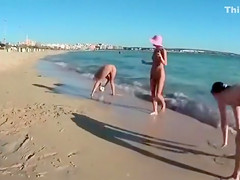 Four playful chicks and one ball