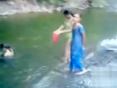 Naked Indian amateur teen swims in the river