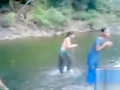Naked Indian amateur teen swims in the river