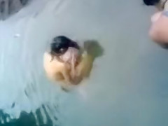 Naked Indian amateur teen swims in the river