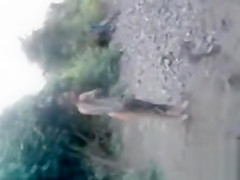 Naked Indian amateur teen swims in the river