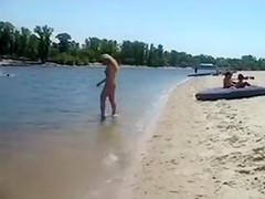 Naked Blonde Girl at the Beach Tanning