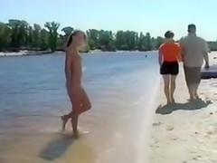 Naked Blonde Girl at the Beach Tanning
