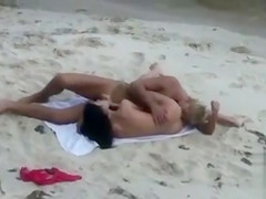 Smoking hot sex on the beach with young couple
