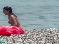 Cute nudist girl filmed voyeur at the beach