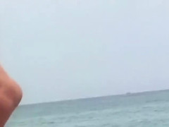 Cute nudist girl filmed voyeur at the beach