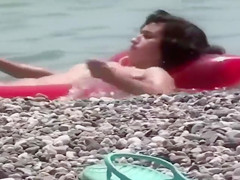 Cute nudist girl filmed voyeur at the beach