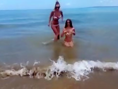 Super horny girls masturbating at the beach
