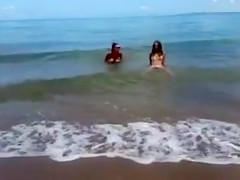 Super horny girls masturbating at the beach
