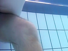 Underwater view with skinny dipping nudist women and men