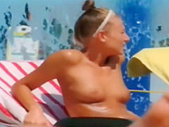 Topless skinny girl looks sexy at the water park