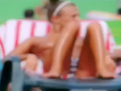 Topless skinny girl looks sexy at the water park