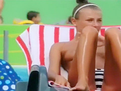 Topless skinny girl looks sexy at the water park