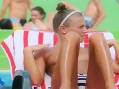 Topless skinny girl looks sexy at the water park