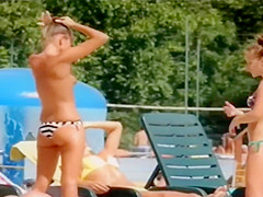 Topless skinny girl looks sexy at the water park