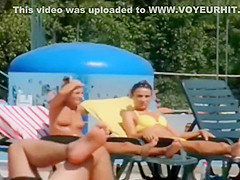 Topless skinny girl looks sexy at the water park