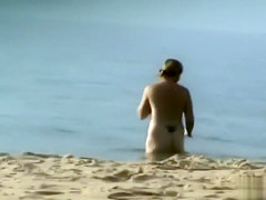 Milf with saggy tits goes skinny dipping in the ocean