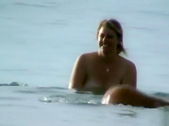 Milf with saggy tits goes skinny dipping in the ocean