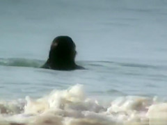 Milf with saggy tits goes skinny dipping in the ocean