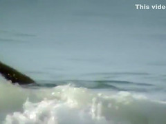 Milf with saggy tits goes skinny dipping in the ocean