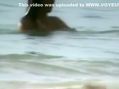 Milf with saggy tits goes skinny dipping in the ocean