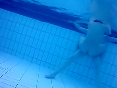 Nudists in the pool get filmed underwater