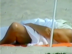 Elder lady sunbaths her saggy twins