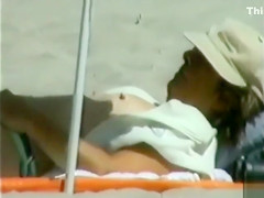 Elder lady sunbaths her saggy twins